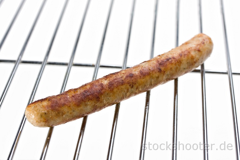 IMG_0790_sausage_ala.jpg - grilled sausage on a grill isolated on white