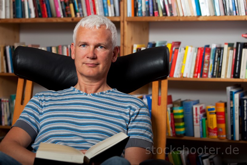 _MG_9615_reading.jpg - handsome man reading in a chair
